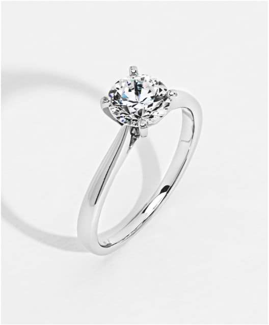 Trending solitaire engagement ring featuring a classic design with a single prominent diamond or gemstone