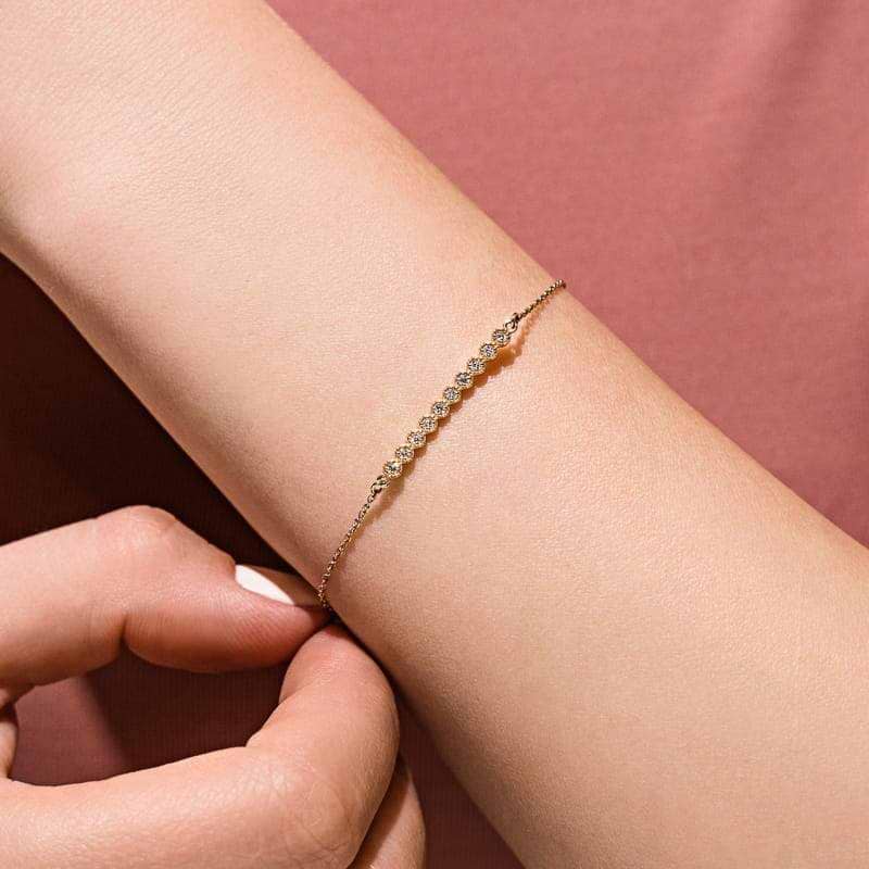 Diamond Bar Bracelet is set with 0.15ctw Lab-Grown Diamonds in a straight bar setting shown in recycled 14k yellow gold 