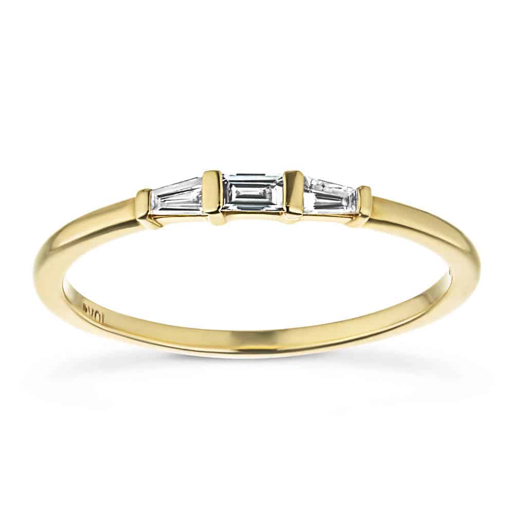 Fashion ring set with three recycled baguette diamonds in recycled 10K yellow gold 