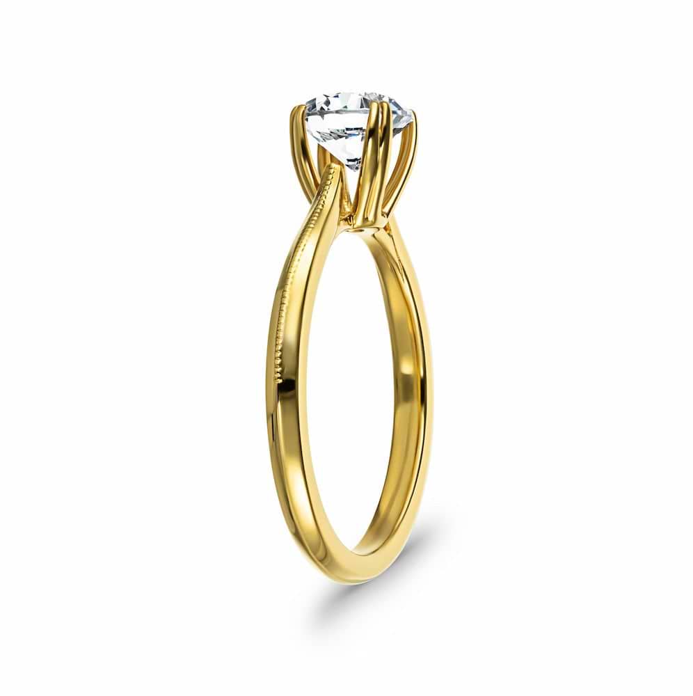 Shown with 1ct Round cut Lab Grown Diamond in 14k Yellow Gold|Modern futuristic sci-fi solitaire engagement ring with unique knife edge shank and double prong head holding a 1ct round cut lab created diamond in 14k yellow gold