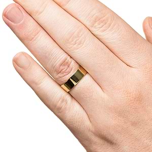 Classic mens wedding band in 6mm 14k yellow gold with high polish finish worn on hand