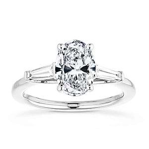 Beautiful three stone engagement ring with trellis set 2ct oval cut lab grown diamond amid baguette side stones in 14k white gold
