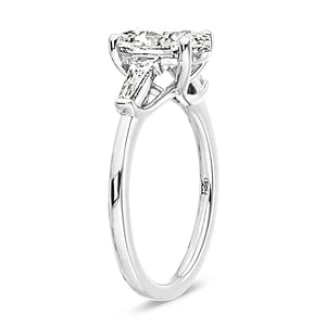Beautiful three stone engagement ring with trellis set 2ct oval cut lab grown diamond amid baguette side stones in 14k white gold shown from side