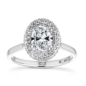 Beautiful vintage style diamond accented halo engagement ring with 1ct oval cut lab grown diamond in 14k white gold band with filigree and milgrain detailing