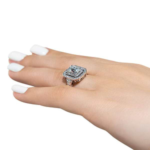 Antique style double halo engagement ring with 1ct emerald cut lab grown diamond in 14k white gold shown worn on hand sideview