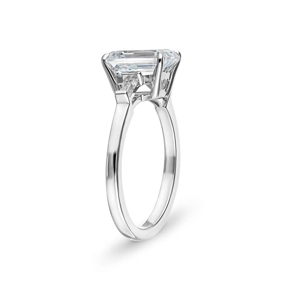 Shown with 1ct Emerald Cut Lab Grown Diamond in 14k White Gold|Baguette side stone engagement ring with 1ct emerald cut lab grown diamond in 14k white gold with peek-a-boo diamonds