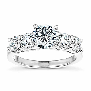 Accented engagement ring with a 1ct round cut lab grown diamond amid diamond hybrid simulants totaling 1ctw in 14k white gold