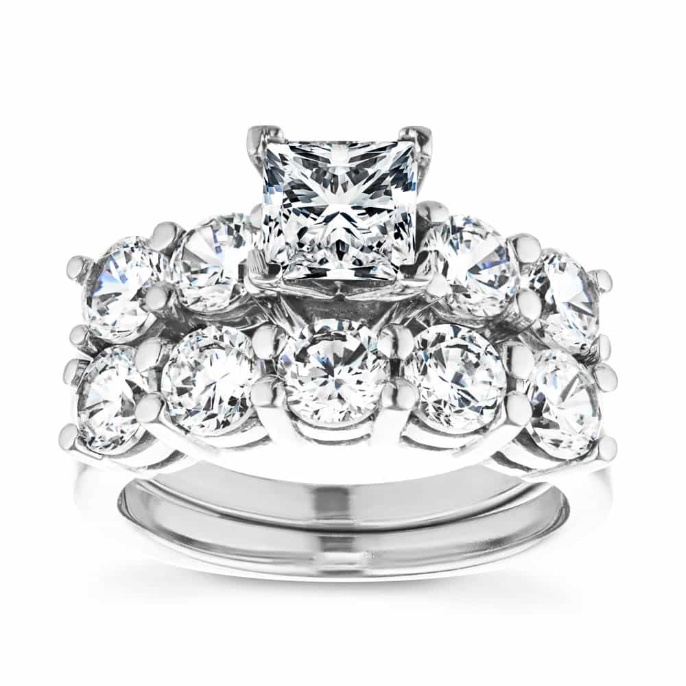 Shown with a 1.0ct Lab-Grown Diamond center stone with 1.0ctw Diamond Hybrid accenting stones in recycled 14K white gold with matching wedding band