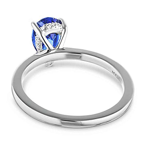 Hidden halo engagement ring with 1ct pear cut lab grown blue sapphire in 14k white gold band shown from beneath