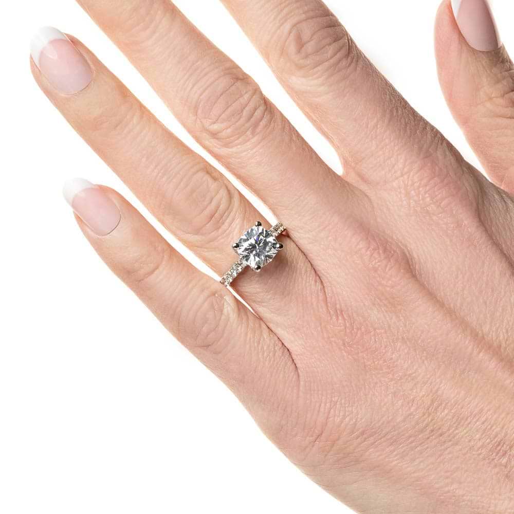 Shown with 1ct Cushion Cut Lab Grown Diamond in Platinum|Diamond accented engagement ring with 1ct cushion cut lab grown diamond set in a four prong trellis in platinum shown worn on hand