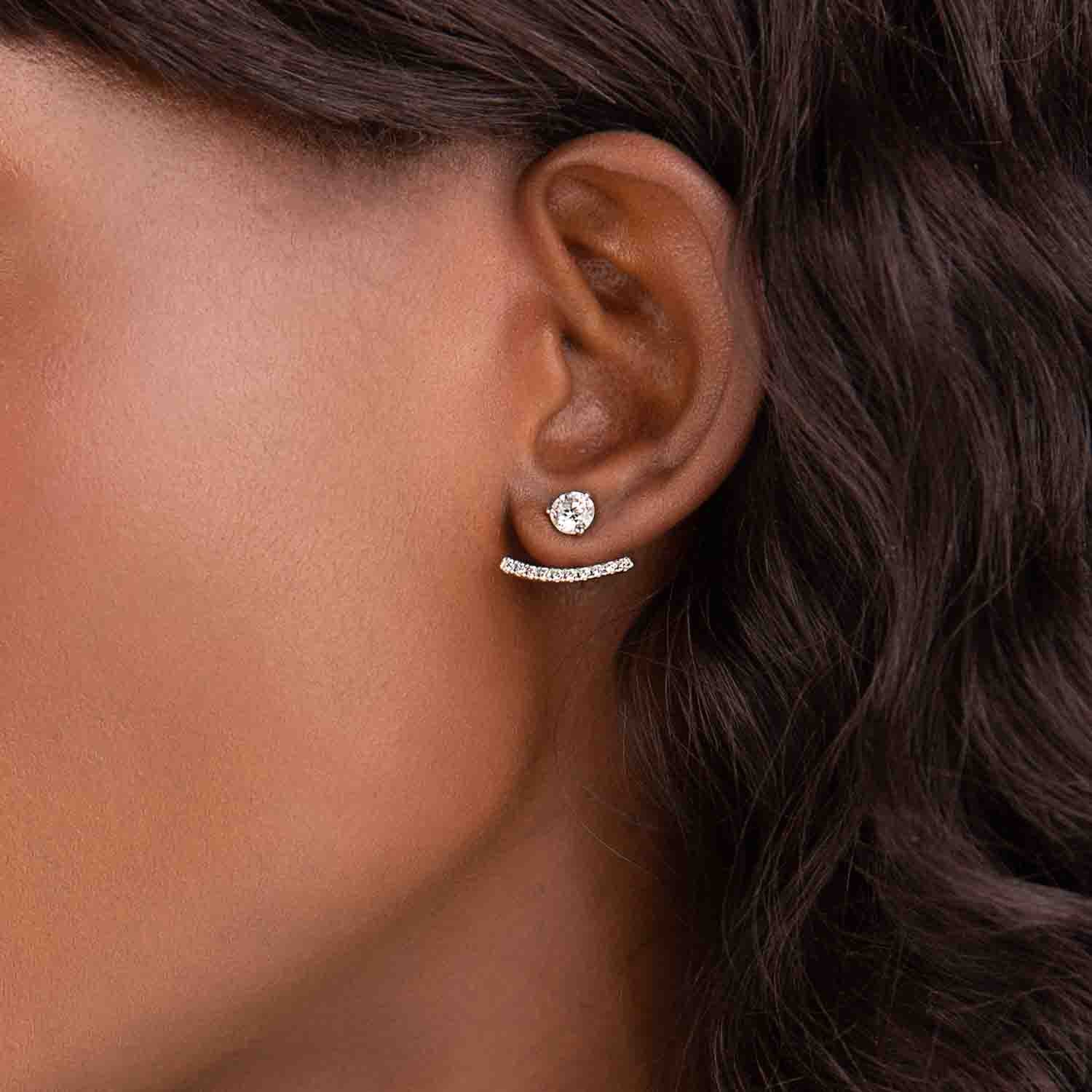 Curved Bar Earring Jackets set with 0.20ctw lab grown diamonds in 14K White Gold and shown with a pair of stud earrings that are not included in the purchase 