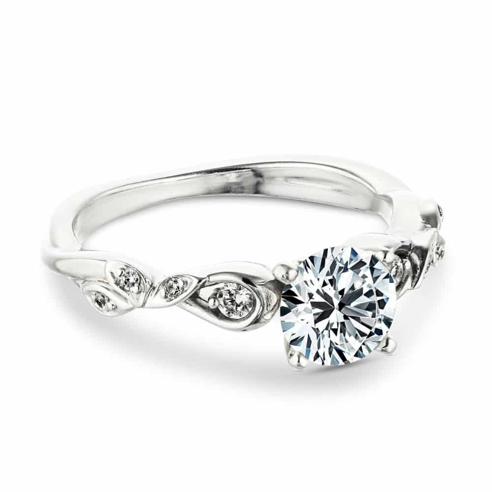 Shown with a 1.0ct Round cut Lab-Grown Diamond with accenting diamonds in recycled 14K white gold 