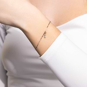woman wearing Elongated box chain initial bracelet in yellow gold with lab grown diamonds from MiaDonna