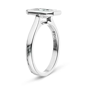 Modern engagement ring with 1ct radiant cut bezel set lab grown diamond in 14k white gold shown from side