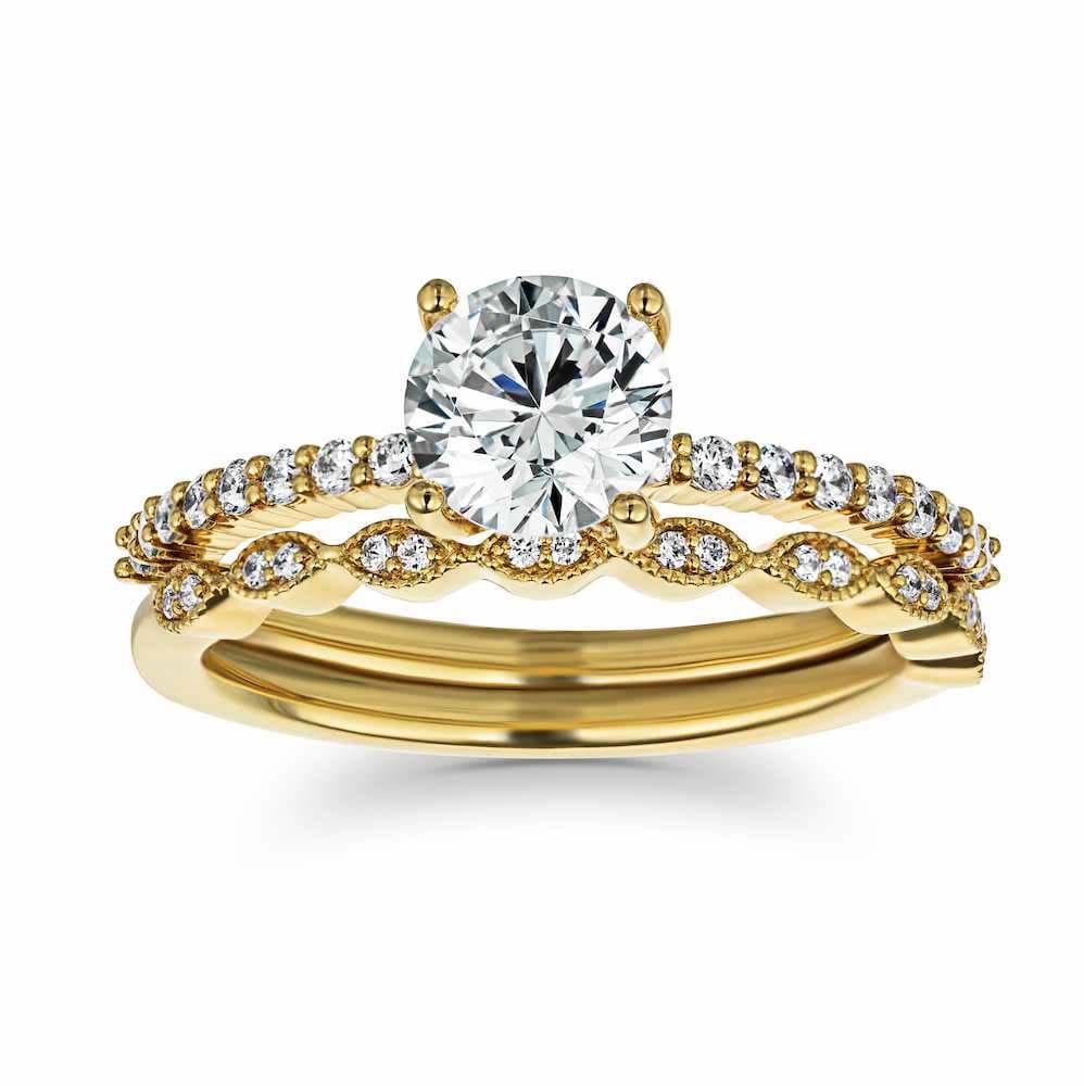 Set shown with a 1ct Round cut Lab Grown Diamond in 14k Yellow Gold|Diamond accented vintage style wedding ring set featuring 14k yellow gold engagement ring with 1ct round cut lab grown diamond
