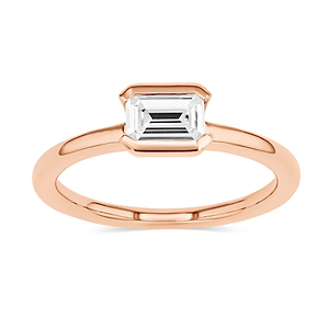 semi bezel solitaire engagement ring with east to west emerald cut center stone set in 14k rose gold