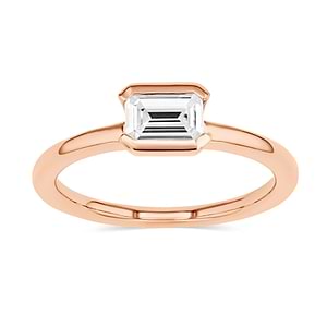 semi bezel solitaire engagement ring with east to west emerald cut center stone set in 14k rose gold