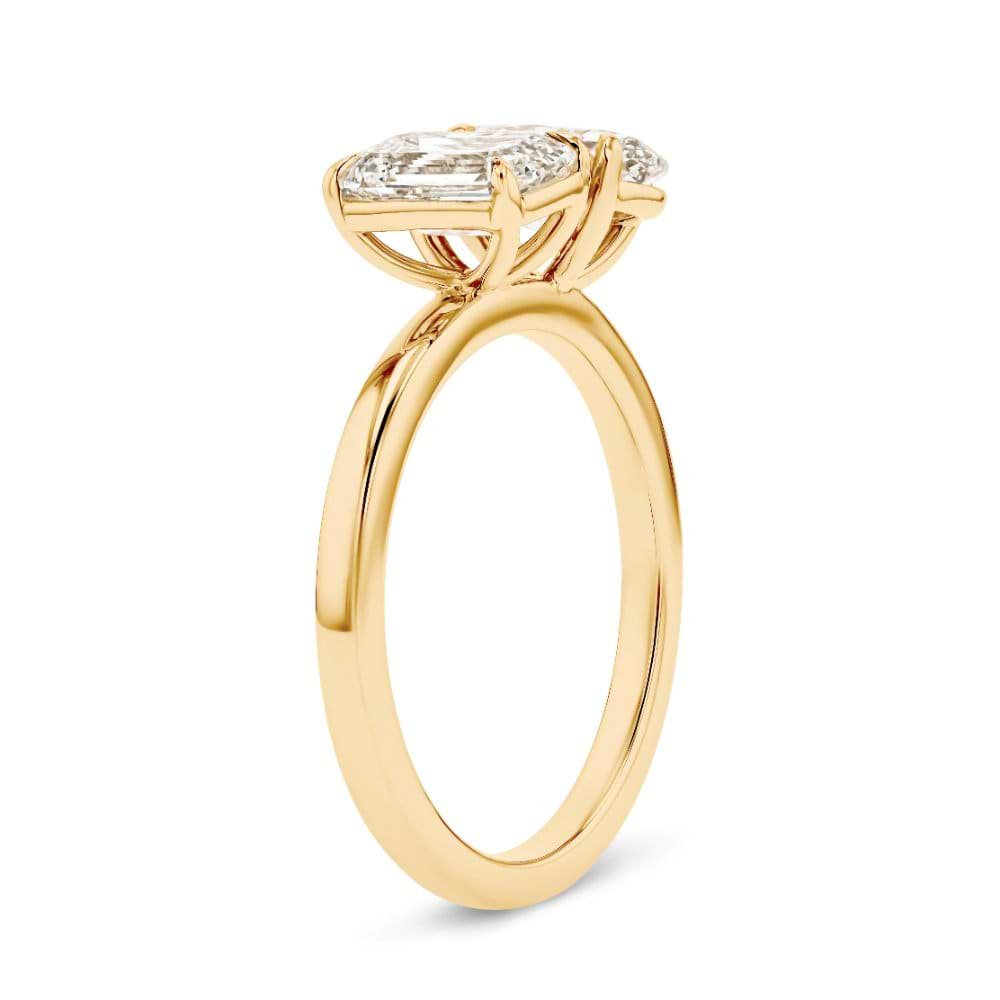 Shown In 14K Yellow Gold With An Emerald Cut and Oval Cut Lab Grown Diamond