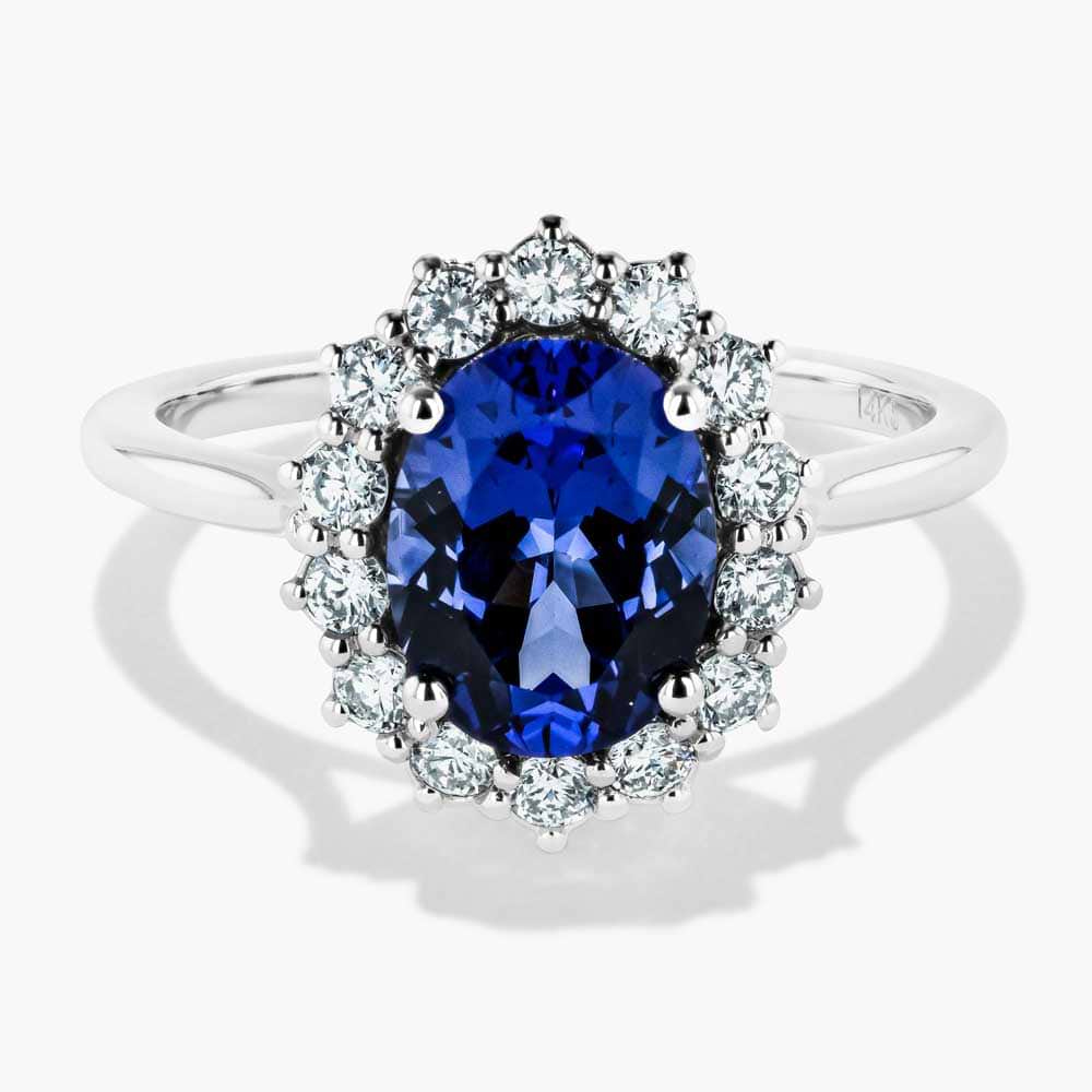 Flora Vintage Engagement Ring shown with a 2.7ct (9mmx7mm) oval cut Lab-Grown Sapphire center stone set in 14K white gold 