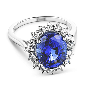 Vintage style engagement ring with floral design halo around a 3ct lab created blue sapphire in 14k white gold