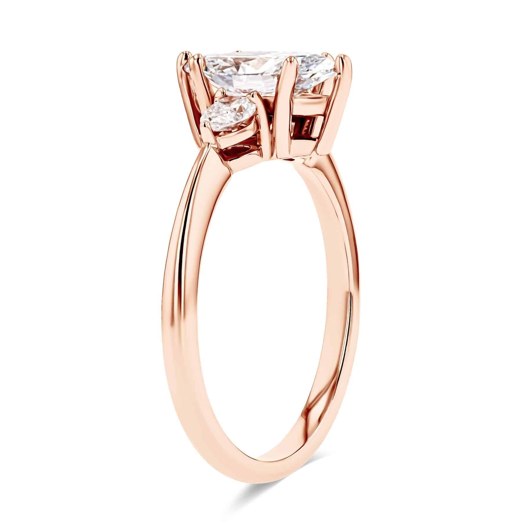 Flourish Three Stone Engagement Ring with a 1.15ct Lab-Grown Diamond center stone set in 14K Rose Gold|three stone engagement ring with marquise shape lab grown diamond center stone in 14k rose gold 