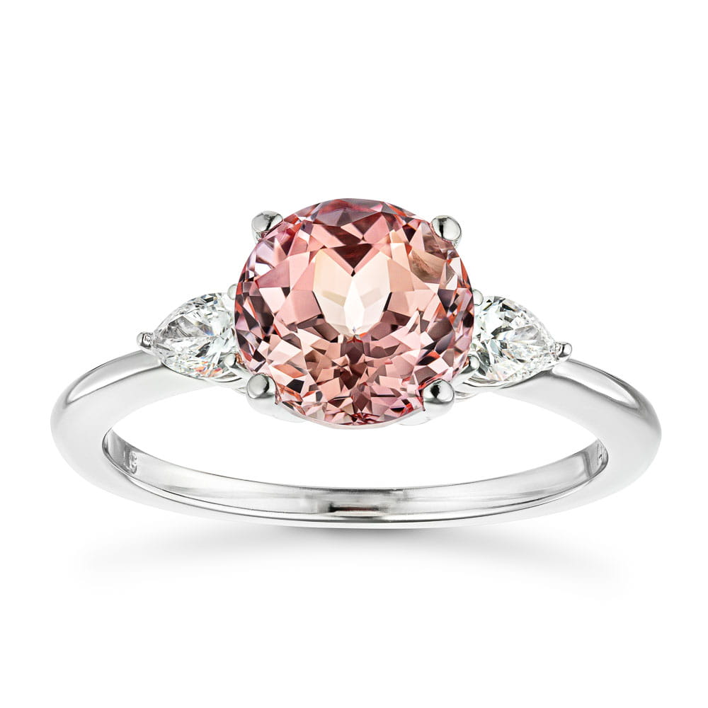 Shown with 2ct Lab Grown Champagne Pink Sapphire in 14k White Gold|Beautiful lab grown champagne pink sapphire engagement ring with pear cut side stones in 14k white gold