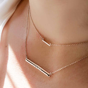Featuring the Galaxy Bar Necklace in 14K rose gold & the Diamond Bar Necklace (sold separately)