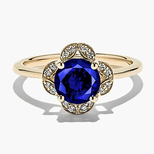 diamond accented halo engagement ring with Blue Sapphire lab created gemstone in 14k yellow gold