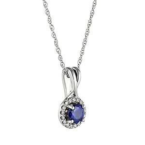  halo blue sapphire pendant in gold