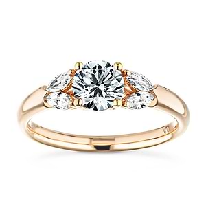 Unique accented engagement ring with 0.75ct round cut lab grown diamond center and 0.20ctw marquise cut side stones in 14k rose gold
