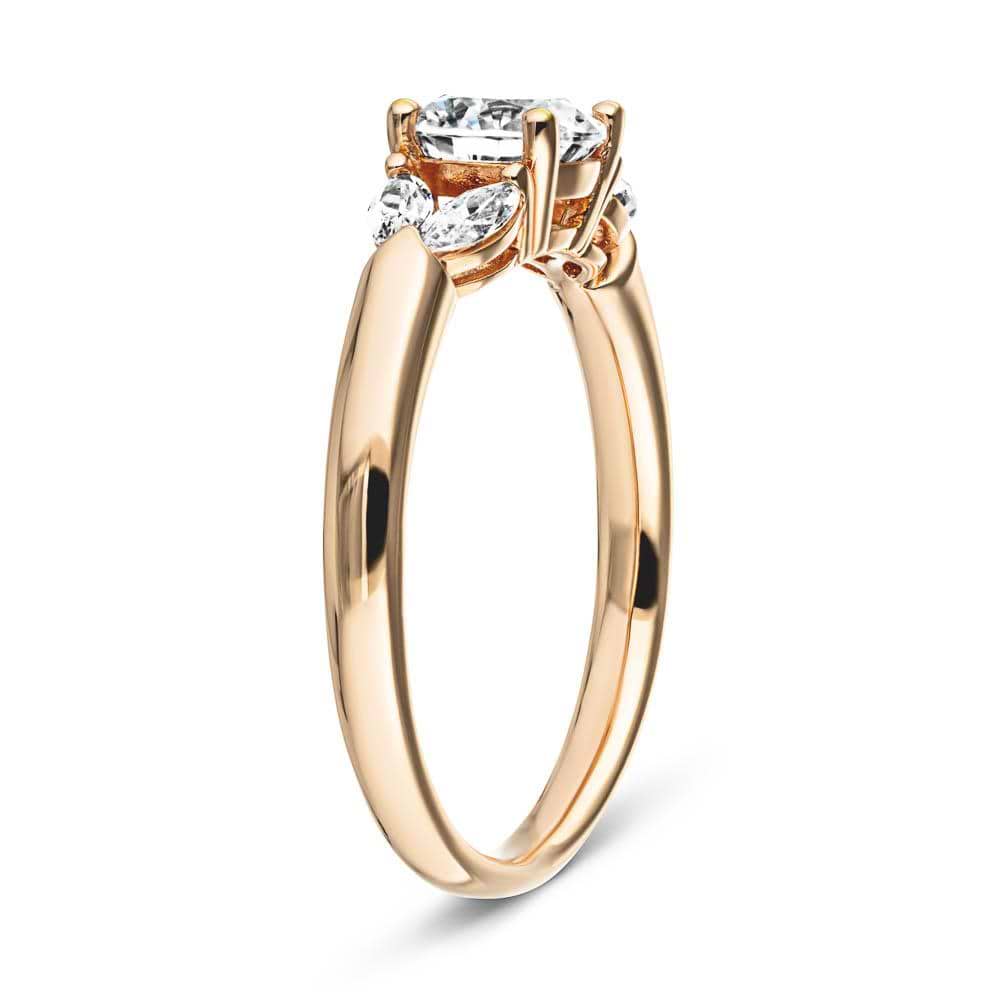 Shown with 0.75ct Round Cut Lab Grown Diamond Center in 14k Rose Gold|Affordable diamond accented engagement ring with 0.75ct round cut lab grown diamond center and 0.20ctw marquise cut side stones in 14k rose gold