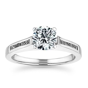 Modern channel set diamond accented engagement ring with 1ct round cut lab grown diamond  set in platinum