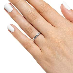  Channel set diamond accented wedding band 