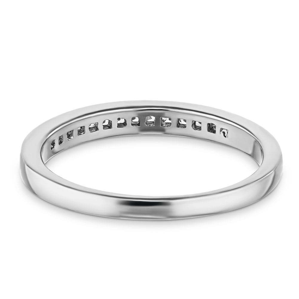 Channel set diamond accented wedding band 