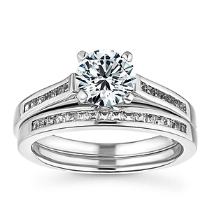  Channel set diamond accented wedding band with matching engagement ring