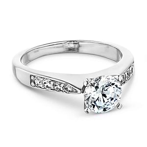 Modern style solitaire engagement ring with a 1ct round cut lab grown diamond and channel set accenting diamonds in 14k white gold