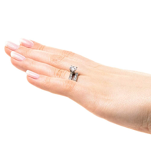  engagement ring Shown with a 1.0ct Round cut Lab-Grown Diamond with accenting stones on the band in recycled 14K white gold with matching wedding band
