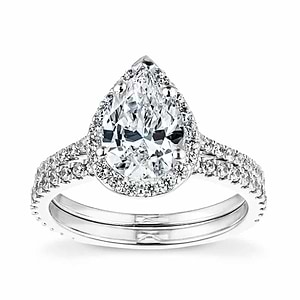  halo diamond accented engagement ring Shown with a 1.0ct Pear cut Lab-Grown Diamond with a diamond accented halo and band in recycled 14K white gold