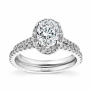  Oval halo diamond accented engagement ring with matching wedding band