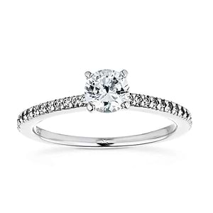 Ethical diamond accented solitaire engagement ring with 4 prong set round cut lab grown diamond in 14k white gold