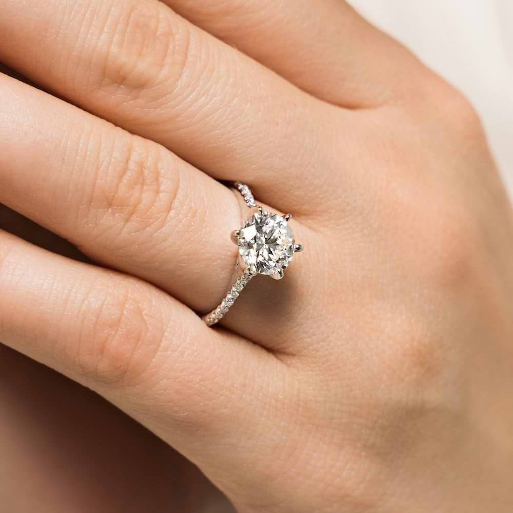 Shown with 1ct Oval Cut Lab Grown Diamond in 14k White Gold|Ethical diamond accented engagement ring with 1ct oval cut lab grown diamond in 14k white gold worn on hand