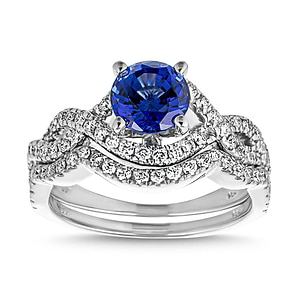 Blue sapphire wedding ring set with wavy twisted band design set with accenting diamonds in 14k white gold