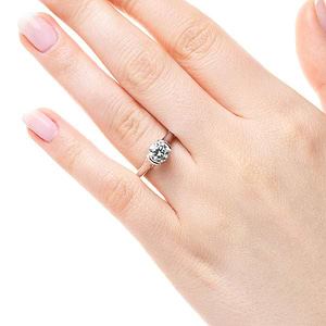 Stackable modern solitaire engagement ring with half bezel set 1ct round cut lab grown diamond in 14k white gold shown worn on hand