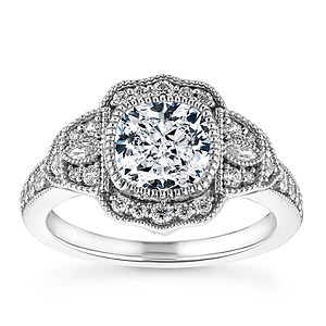 Gorgeous vintage style diamond accented halo engagement ring with 1ct cushion cut lab grown diamond in 14k white gold milgrain and filigree detailed band