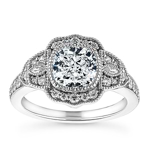 Gorgeous vintage style diamond accented halo engagement ring with 1ct cushion cut lab grown diamond in 14k white gold milgrain and filigree detailed band