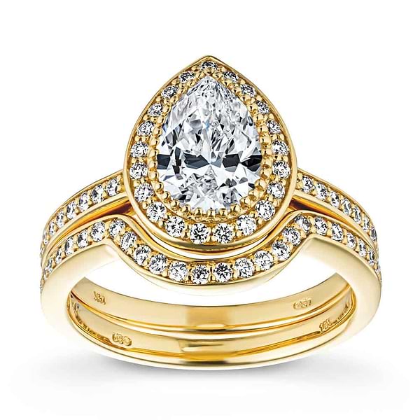 Shown with a 1.0ct Pear cut Lab-Grown Diamond with a diamond accented halo and band in recycled 14K yellow gold with matching wedding band | french engagement ring Shown with a 1.0ct Pear cut Lab-Grown Diamond with a diamond accented halo and band in recycled 14K yellow gold matching wedding band