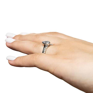  stackable wedding set Shown with a bezel set 1.0ct Pear cut Lab-Grown Diamond in recycled 14K white gold with the matching diamond accented band