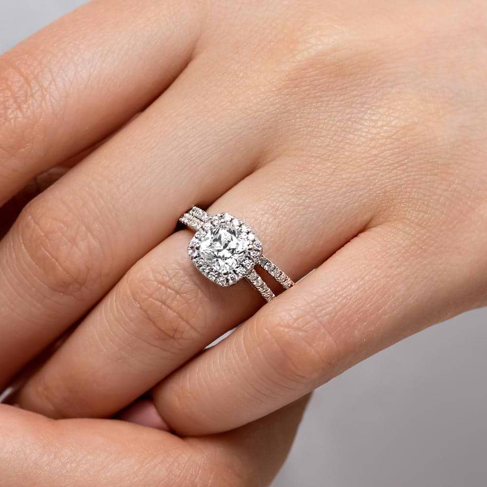 Shown with a 1.0ct Cushion cut Lab-Grown Diamond with a diamond accented halo and diamonds accenting the band in recycled 14K white gold with matching band, purchase the set for a discount 