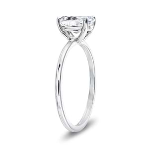 Classic solitaire engagement ring with 1ct oval cut lab grown diamond in 14k white gold band shown from side