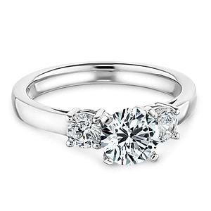 Elegant three stone ring with 1ct round cut lab grown diamond and two diamond shoulder stones in 14k white gold
